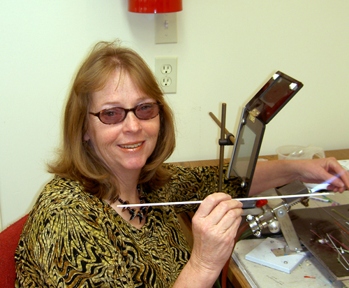 Susan Darger working at her hot glass torch